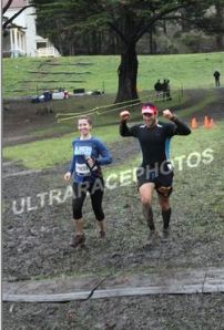 Crossing the finish line at last year's muddy race.